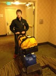 It must be an alpaca road trip! Sam pushes our dolly towards the hotel elevator on Wednesday morning, 4/17 with some 150+ lb. of water jugs. His relative good cheer given that this was taken at 5:30 AM was most likely because of the fact that we were on our way to get donuts. Homer Simpson has a point.